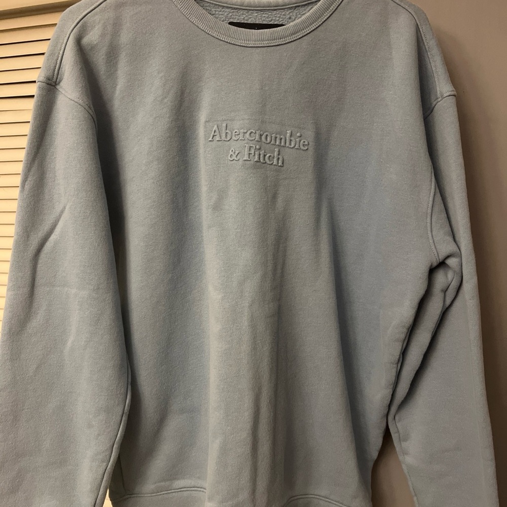 Abercrombie & Fitch crewneck in blue color with embossed logo.  Size Medium